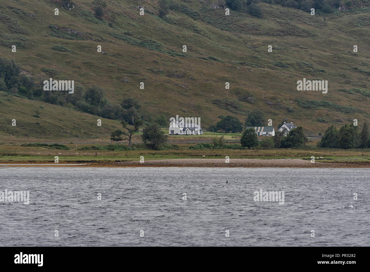 White house at Fort William and Loch Linnhe views of water and mountains in Scotland Stock Photo