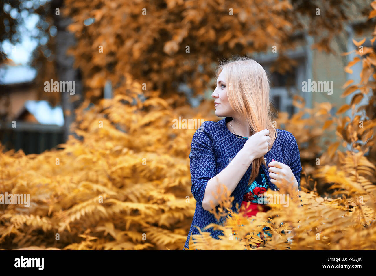 Girl in the street with an umbrella Stock Photo - Alamy