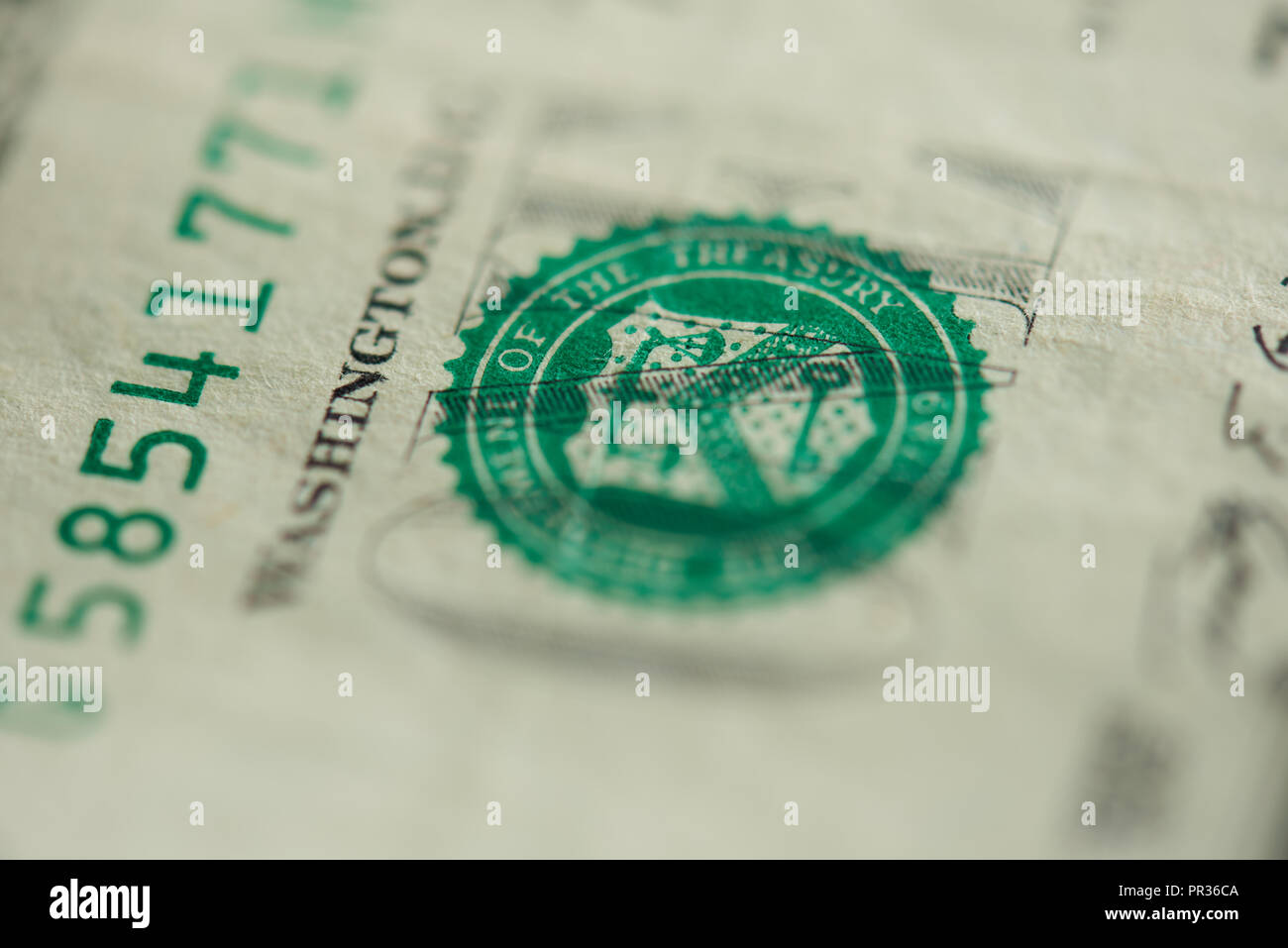 Green stamp on one dollar bill stamp close up view Stock Photo - Alamy