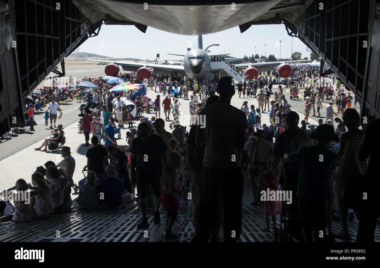 Service members and members from the local community walk off a C-5 Galaxy during SkyFest 2017 Air Show and Open House at Fairchild Air Force Base, Washington, July 29, 2017. SkyFest is Fairchild’s air show and open house to give the local and regional community the opportunity to meet Airmen and learn about the Air Force mission. Stock Photo
