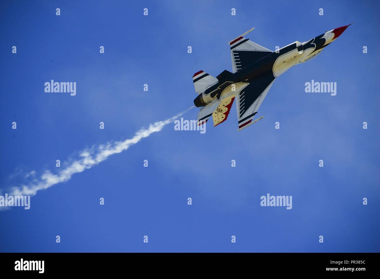 One of the U.S. Air Force Aerial Demonstration Squadron “Thunderbirds” flies in formation during SkyFest 2017 Air Show and Open House at Fairchild Air Force Base, Washington, July 30, 2017. SkyFest was an opportunity to give the local and regional community a chance to view Airmen and our resources. Stock Photo