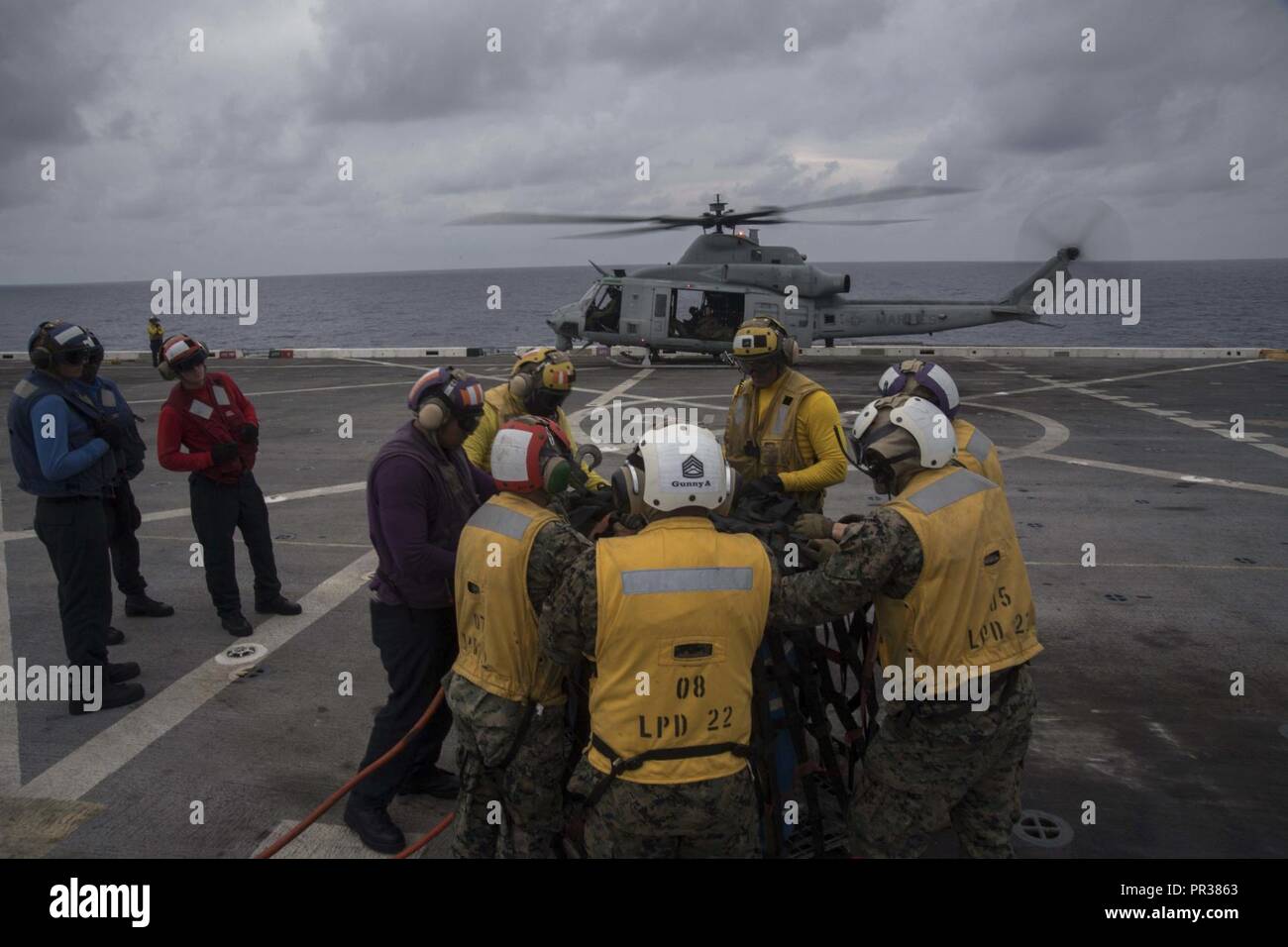 PACIFIC OCEAN (July 31, 2017) Sailors assigned to the Air department and Marines assigned to Marine Medium Tiltrotor Squadron (VMM) 161 (reinforced) aboard the amphibious transport dock ship USS San Diego (LPD 22), assemble a cargo container on the ship’s flight deck. San Diego, part of the America Amphibious Ready Group, with embarked 15th MEU, is operating in the Indo-Asia Pacific region to strengthen partnerships and serve as a ready-response force for any type of contingency. Stock Photo