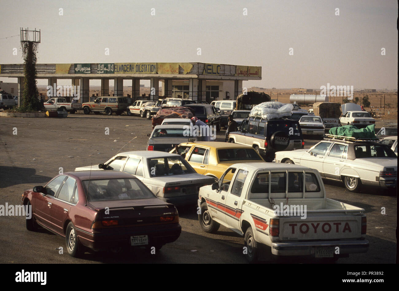 Saudi Arabian cars line up to get gas at a filling station before the ...