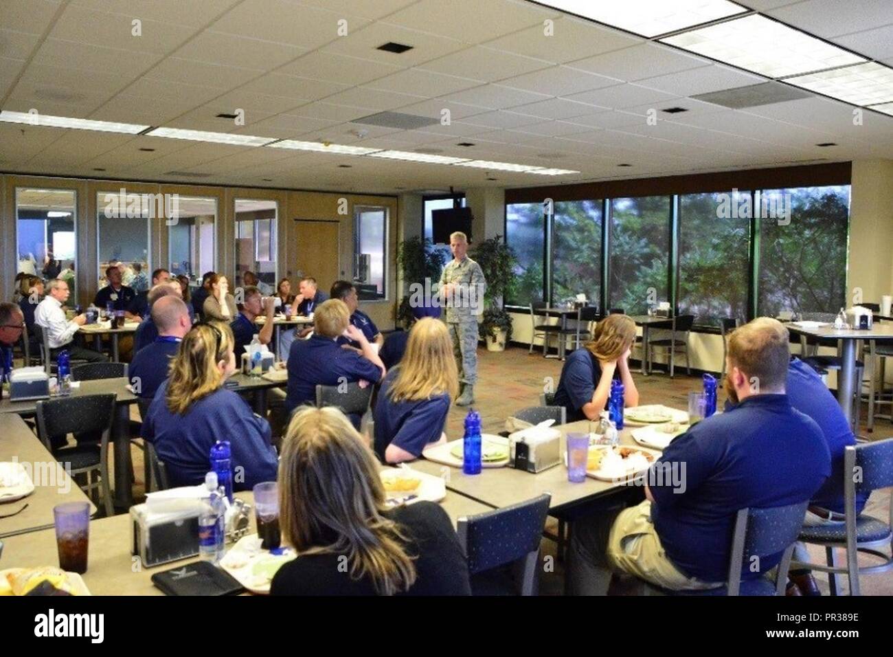 Col. Stephen Slade, 310th Operations Group commander, speaks to FIRST