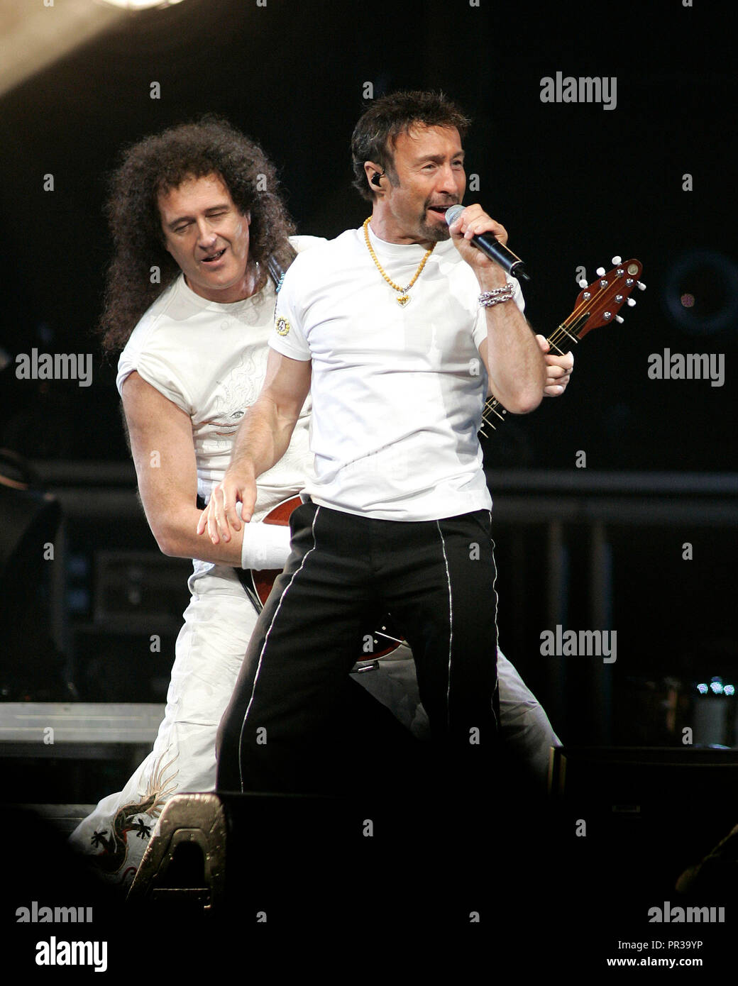 Brian May(L) and Paul Rodgers with Queen perform in concert at the American Airlines Arena in Miami, Florida on March 3, 2006. Stock Photo