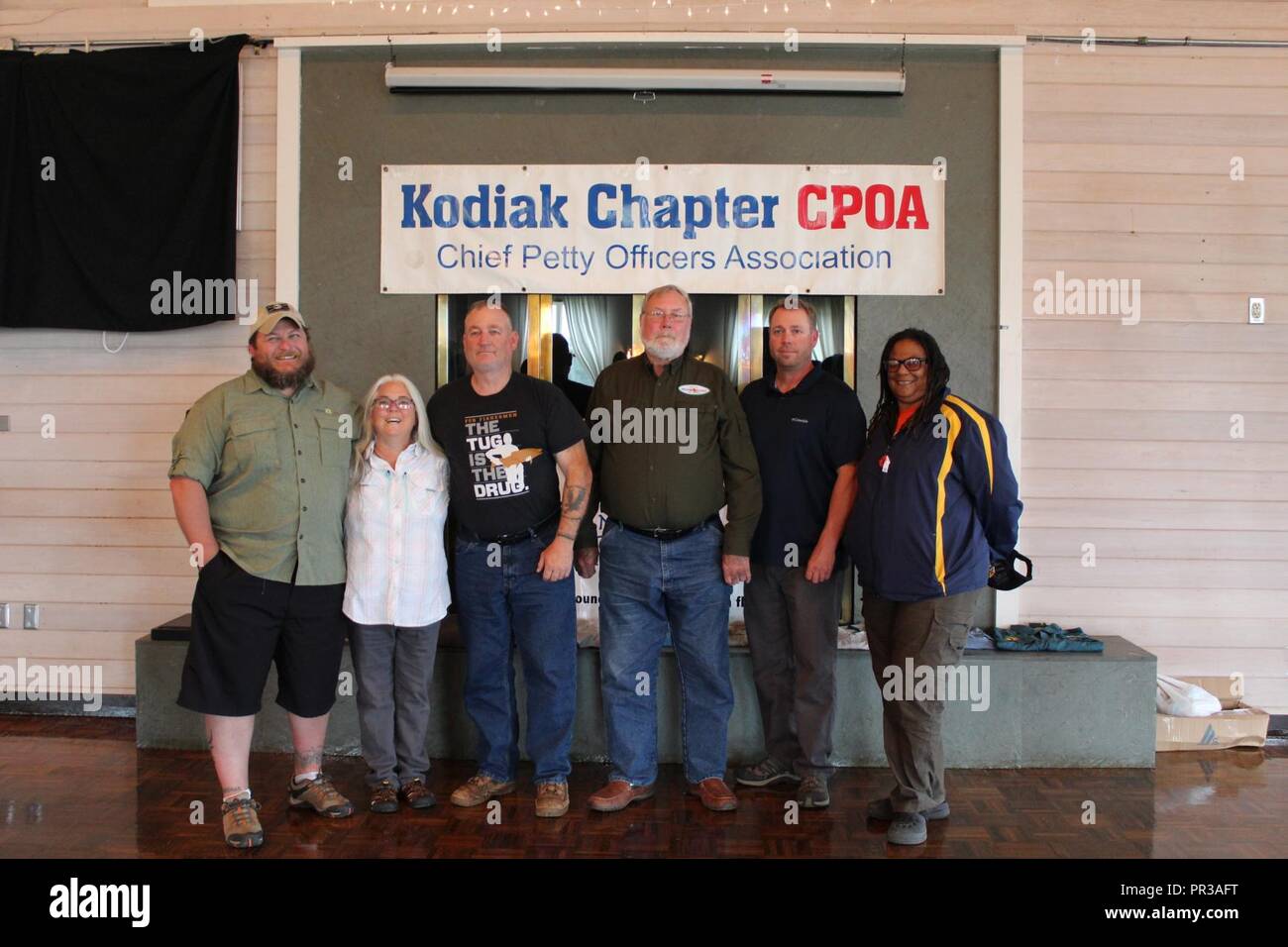 Six veterans pose at the Golden Anchor in Kodiak, Alaska, July 28, 2017. These veterans came to