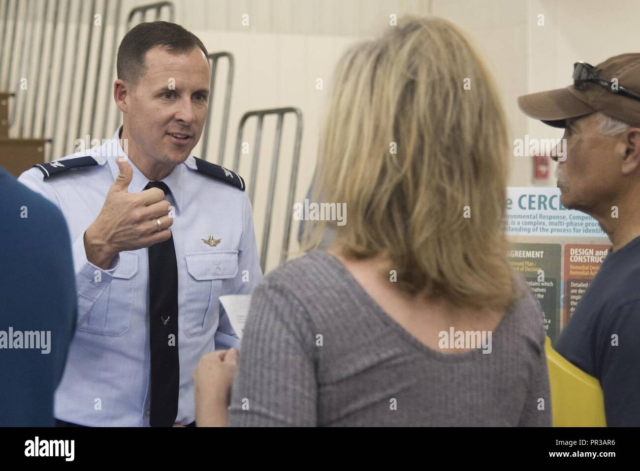 FOUNTAIN, Colo. - Col. Todd Moore, 21st Space Wing commander, answers Colorado Springs community members’ questions during an open house at Janitell Junior High School, July 25, 2017, Fountain, Colo. The open house was one of several AFCEC and 21st SW community engagements discussing the site inspection report released earlier that day covering an update on the perfluorooctane sulfonate and perfluorooctanoic acid contamination. They also met with key state and federal members during a closed-door meeting followed with a media roundtable and the open house. Stock Photo