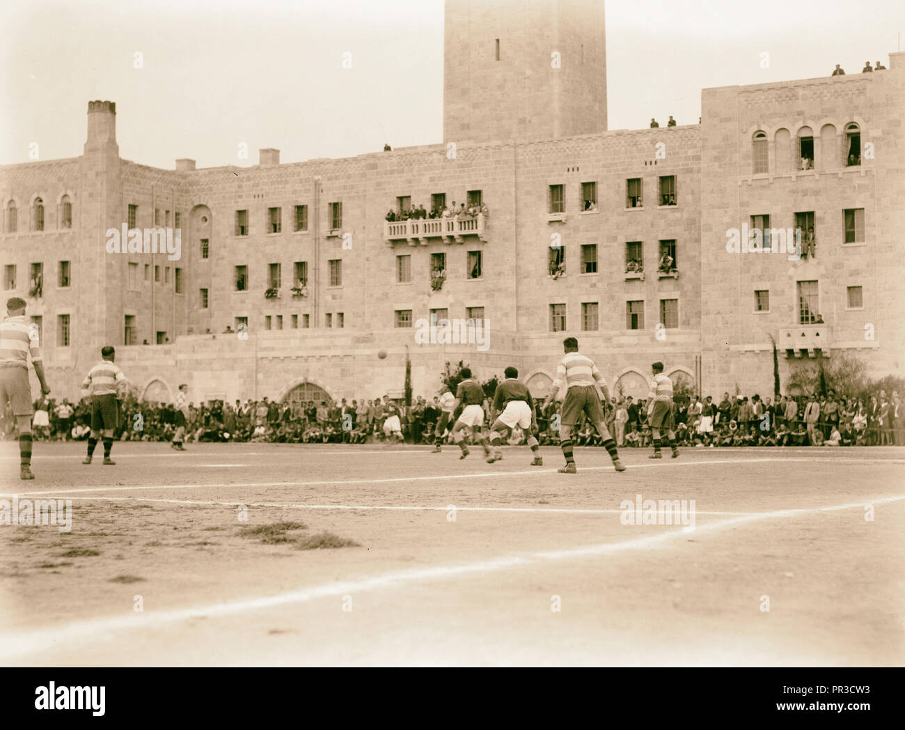 Football game 'Y' versus British Army. The game in progress, 'Y' building in gackground, Jerusalem, Israel Stock Photo