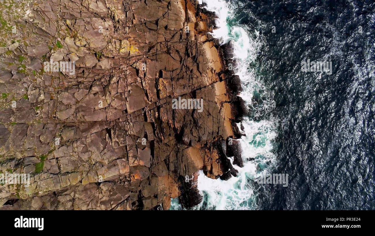 Deep blue ocean water and steep cliffs from above Stock Photo - Alamy