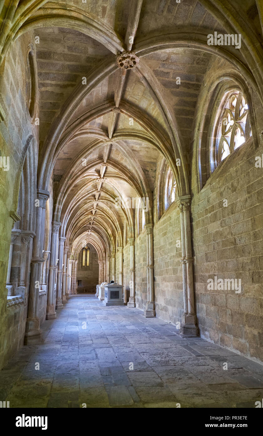 EVORA, PORTUGAL - JULY 01, 2016:  The interior of medieval cloister of Evora Cathedral (Se) with the massive arcade made of granite. Portugal Stock Photo