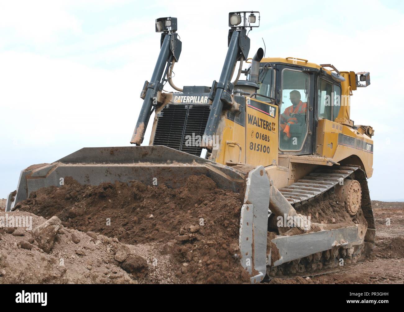 A Caterpillar D8T Bulldozer fitted with a semi universal blade and