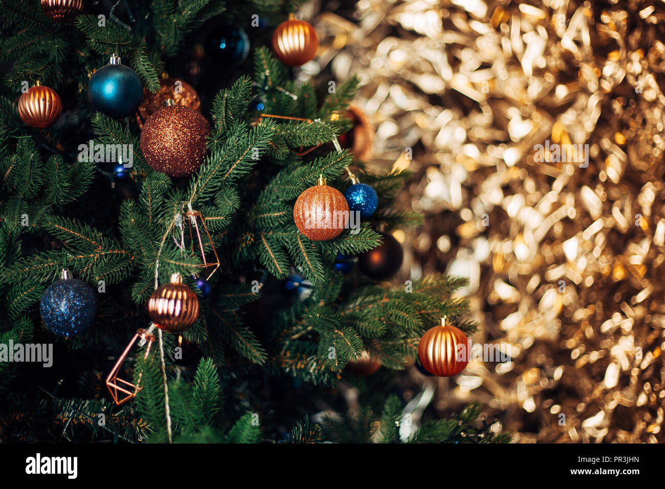 christmas tree with colorful balls and gift boxes over white gold ...