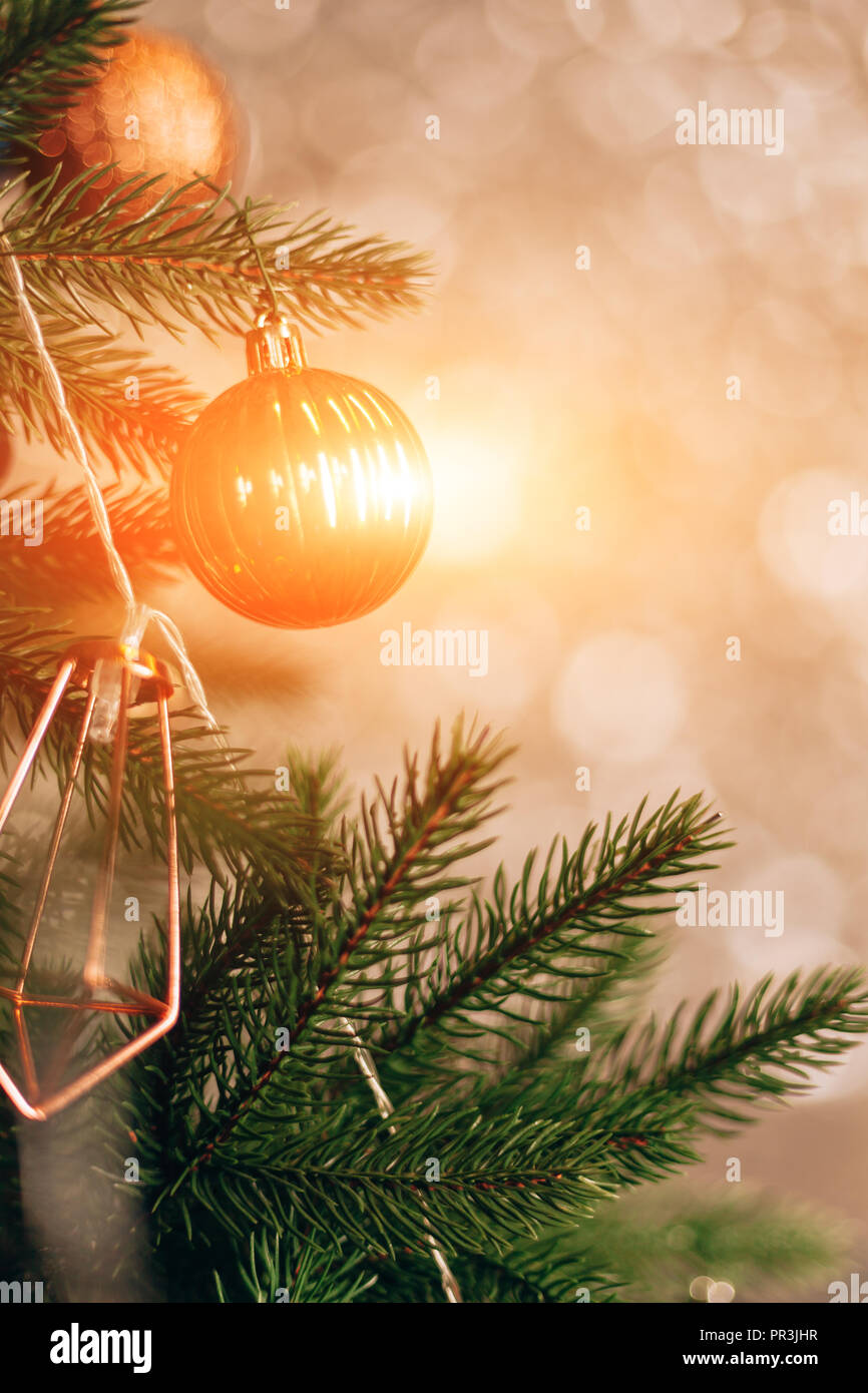 christmas tree with colorful balls and gift boxes over white ...