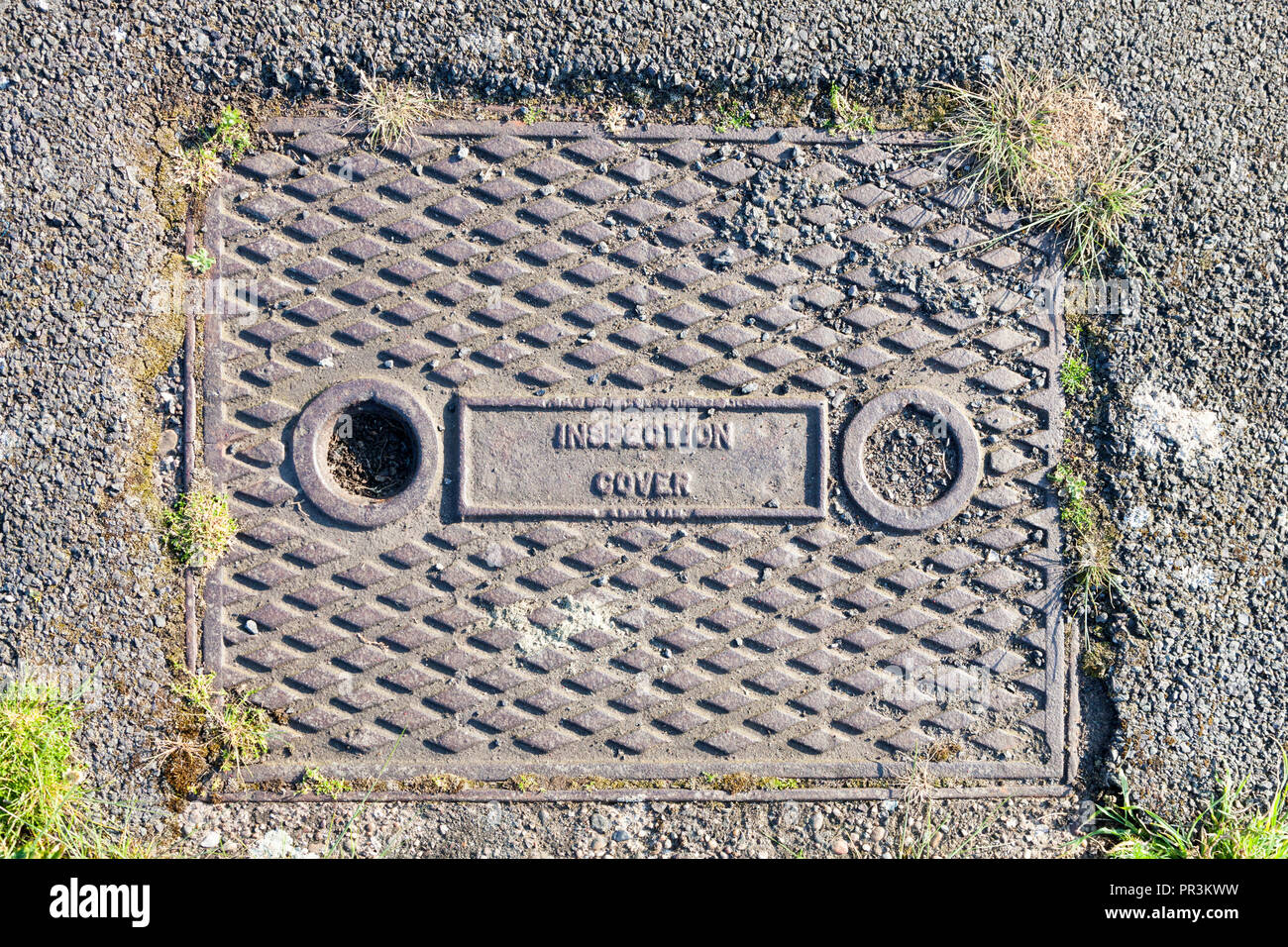 Manhole cover or inspection chamber cover on a path, Nottingham, England, UK Stock Photo