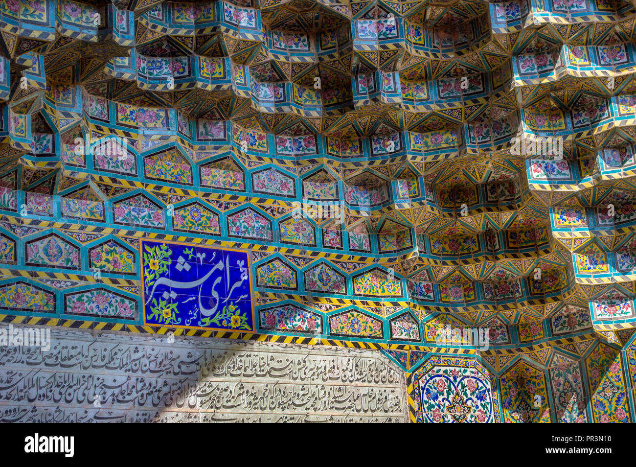 Persian tiling and writing on a building Stock Photo - Alamy