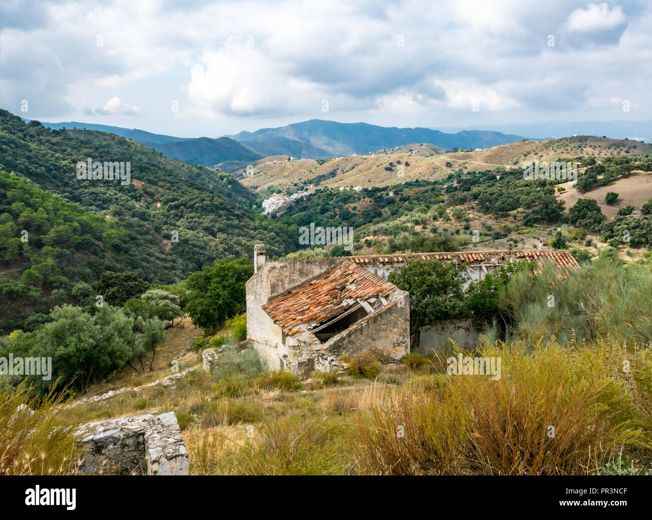 GR mountain walking route 249 view valley and ruined buildings, Sierras de Tejeda Natural Park, Salares, Axarquia, Andalucia, Spain Stock Photo