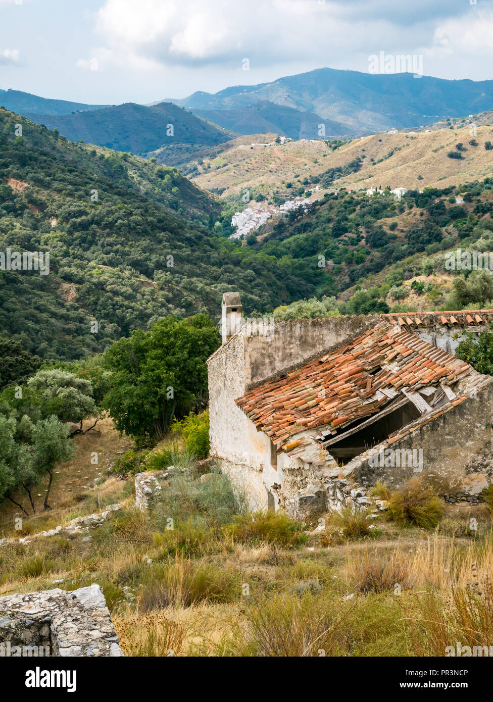 GR mountain walking route 249 view valley and ruined buildings, Sierras de  Tejeda Natural Park, Salares, Axarquia, Andalucia, Spain Stock Photo - Alamy