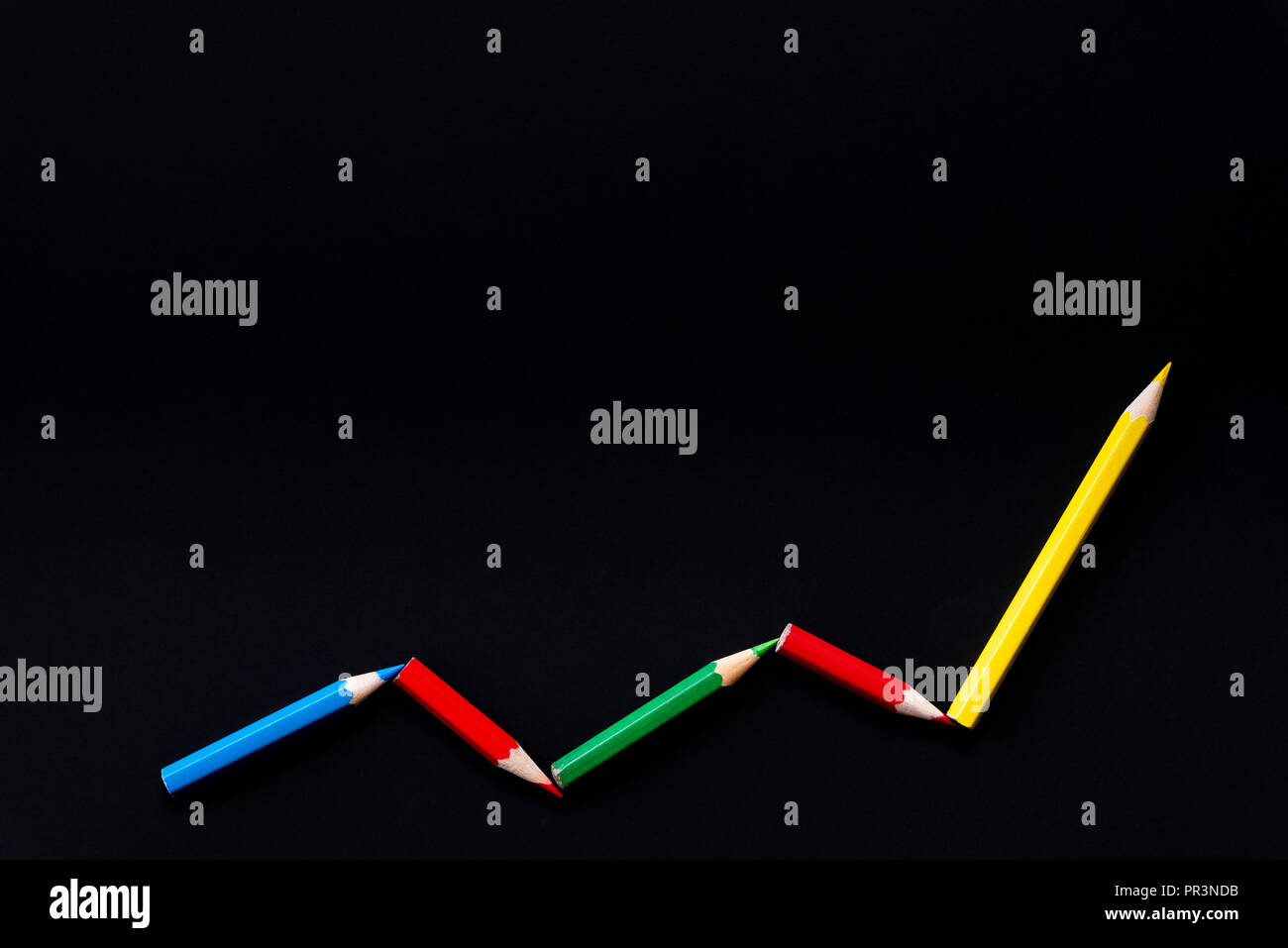 Color pencil in a pattern of a graph on black color background with ...