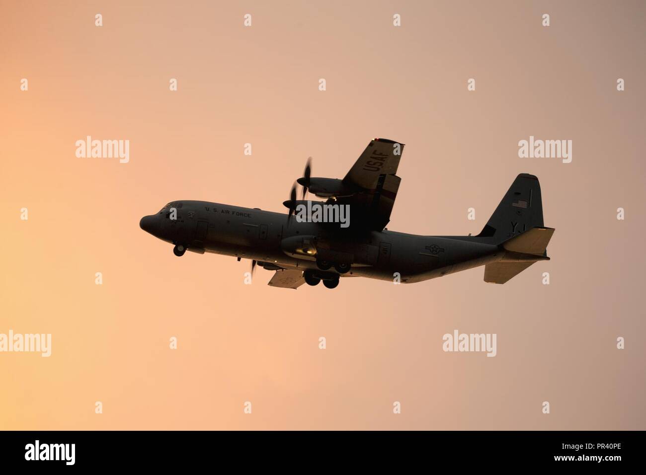A C-130J Super Hercules from the 36th Airlift Squadron conducts a flight mission over Yokota Air Base, Japan, July 31, 2017. The C-130J provides tactical airlift worldwide and its flexible design allows it to operate in austere environments. Stock Photo
