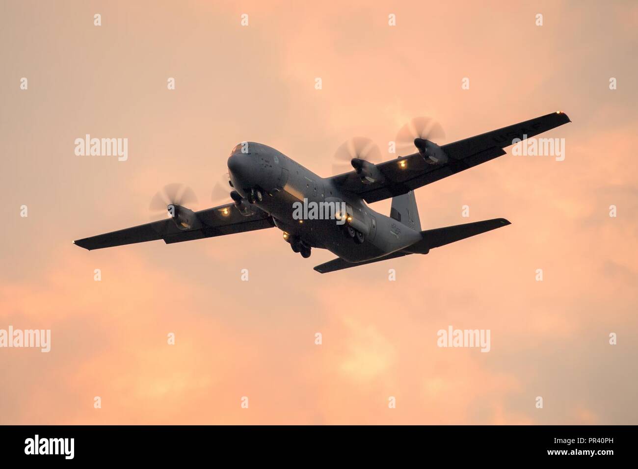 A U.S. Air Force C-130J Super Hercules from the 36th Airlift Squadron maneuvers during a training mission over Yokota Air Base, Japan, July 31, 2017. The C-130 provides tactical airlift worldwide and its flexible design allows it to operate in austere environments. Stock Photo