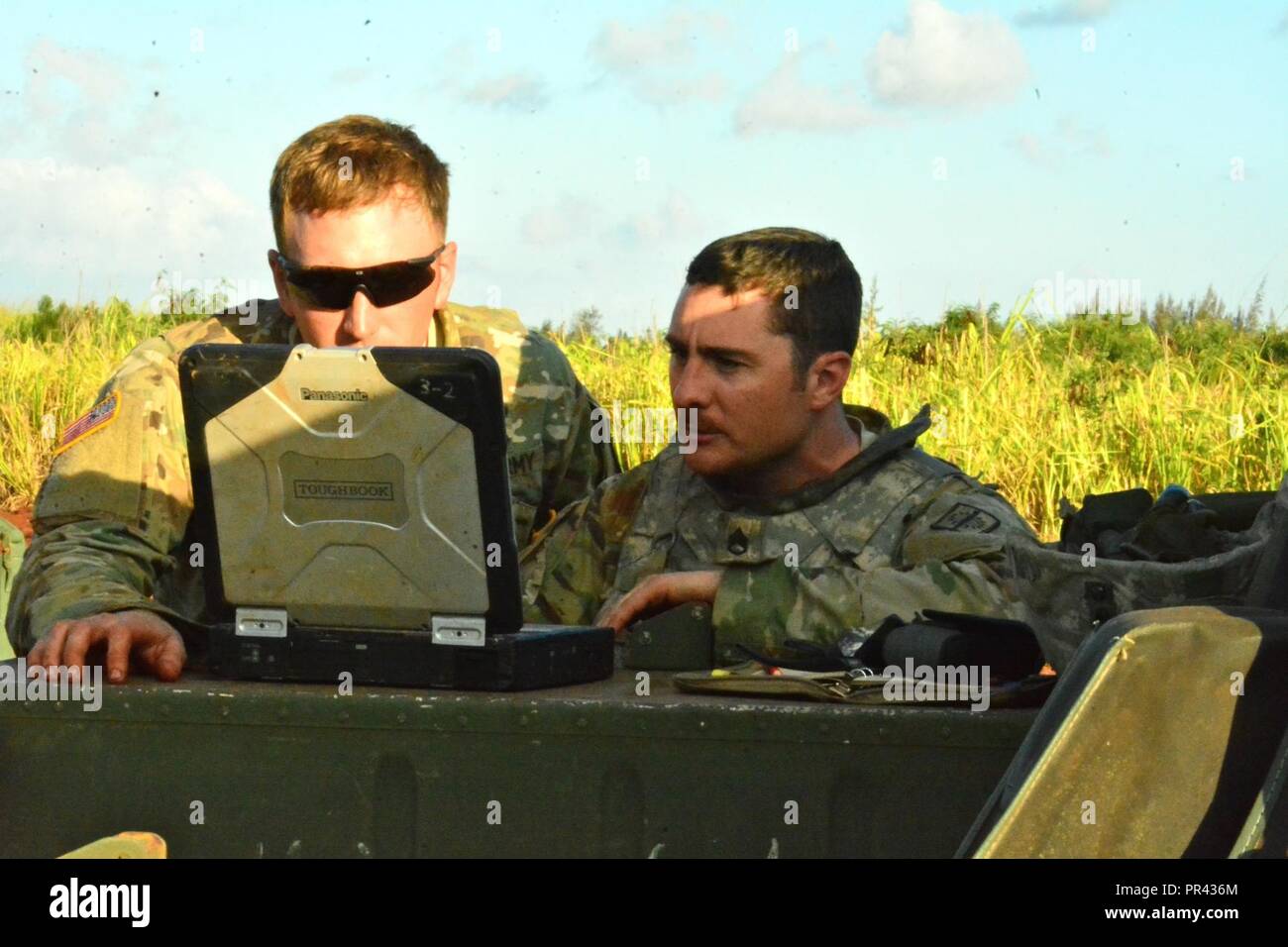 Staff Sgt. Joel Vaccaro and Spc. Cody Mackenn, an Explosive Ordnance Disposal Team from 716th Ordnance Company (Explosive Ordnance Disposal), review technical data during the 2017 United States Army Pacific Command Team of the Year Competition at Schofield Barracks, Hawaii, July 29. Stock Photo