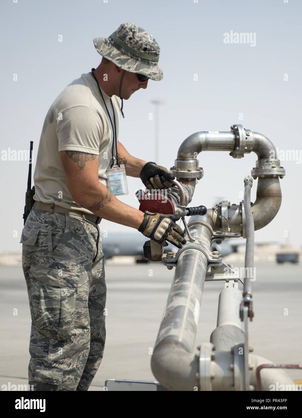 U.S Air Force Tech. Sgt. Matthew Kaski, dayshift supervisor with the 379th  Expeditionary Logistics Readiness Squadron, Fuels Management Flight,  completes refueling his truck at Al Udeid Air Base, Qatar, July 24, 2017.