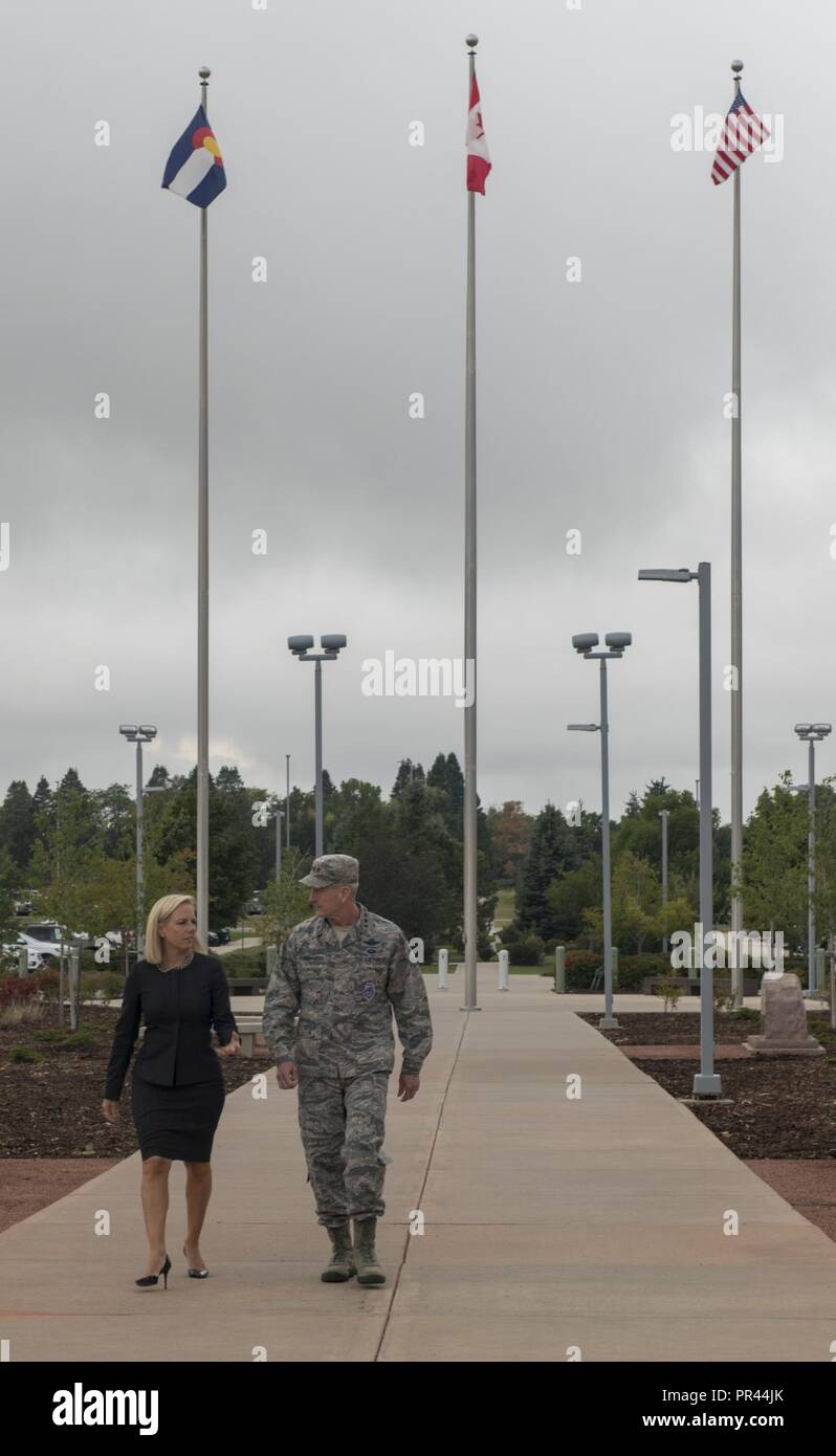 General Terrence J. O’Shaughnessy, commander of North American Aerospace Defense Command and U.S. Northern Command, talks with Department of Homeland Security Secretary Kirstjen Nielsen just prior to entering the NORAD and USNORTHCOM headquarters on September 6, 2018.  O’Shaughnessy and Nielsen met to discuss the strong relationship between the agency and the commands, and to discuss the complementary roles of homeland security and the commands’ top priority, homeland defense. Stock Photo