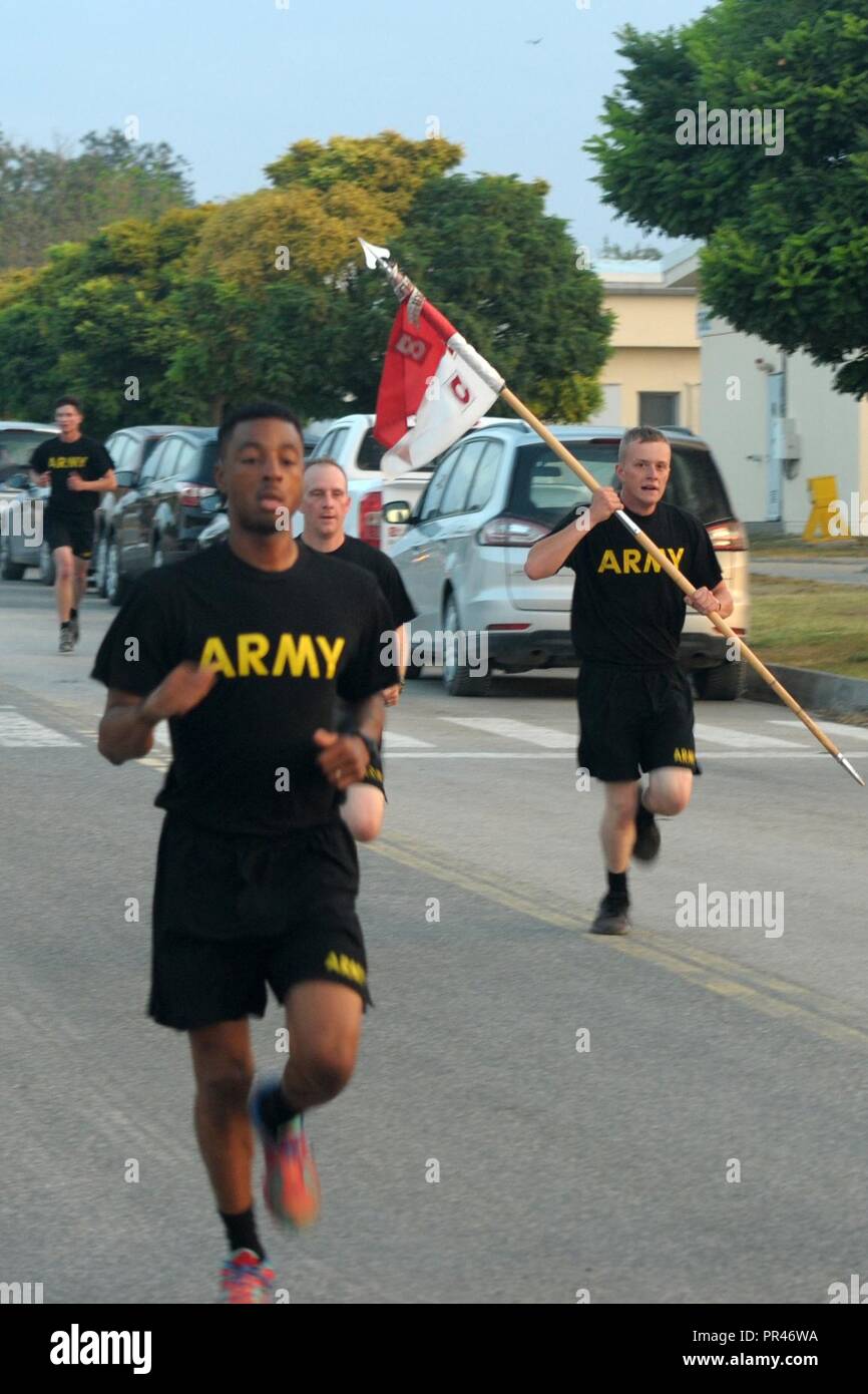 U.S. Airmen and Soldiers, Romanian, Canadian armed forces members and civilian staff run in a five-kilometer race as part of a 9/11 memorial event at Mihail Kogalniceanu Air Base in Romania, Sept. 11, 2018.  The run took place to remember the 2,996 lives taken during the attack on the World Trade Center and the Pentagon 17 years ago. Stock Photo