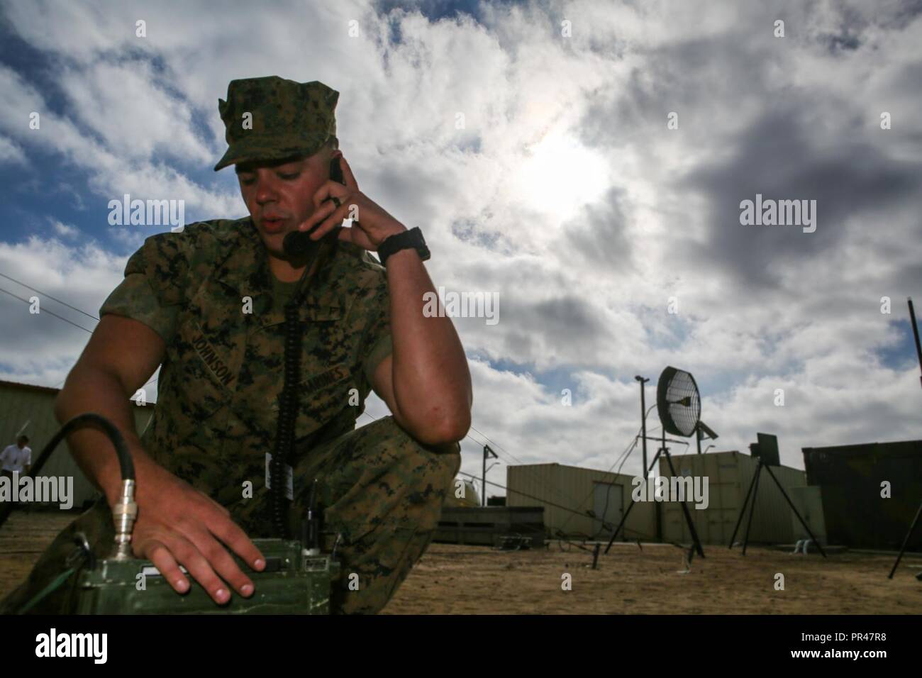 U.S. Marine Corps Lance Cpl. Bryce Johnson, a radio operator with Special  Purpose Marine Air-Ground Task Force Crisis Response Central Command 19.1,  tests a radio connection during a command post exercise on