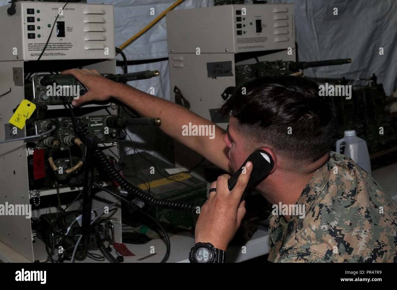 U.S. Marine Corps Lance Cpl. Bryce Johnson, a radio operator with Special  Purpose Marine Air-Ground Task Force Crisis Response Central Command 19.1,  adjusts radio controls during a command post exercise on Marine