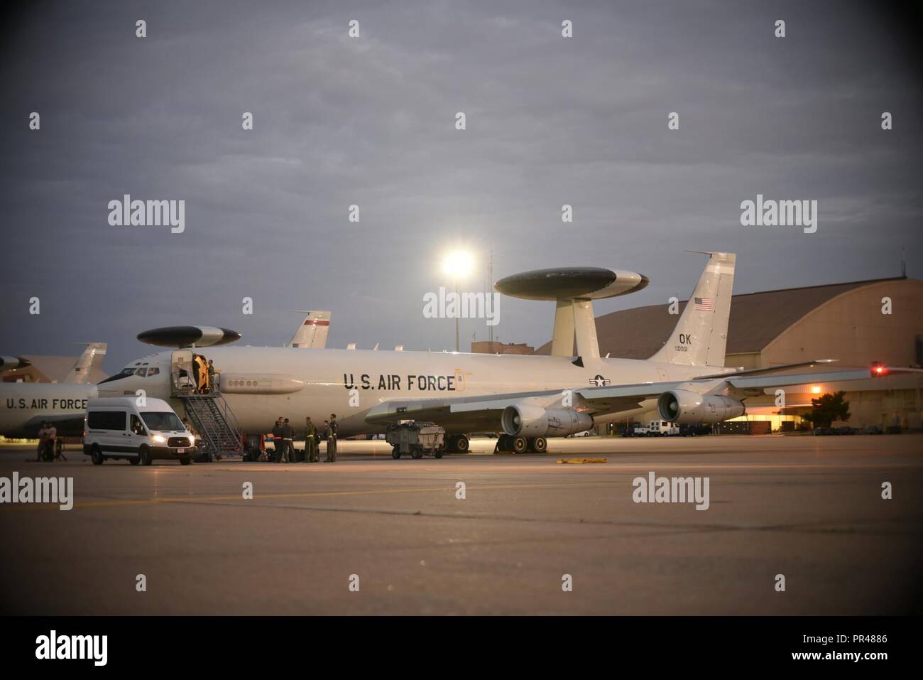 An E-3G Airborne Warning and Control System aircraft of the 552nd Air Control Wing, 960th Airborne Air Control Squadron, is prepared during the early morning hours of Sept. 15, 2018 for a response to Hurricane Florence mission at Tinker Air Force Base, Oklahoma. The AWACS will provide air control and de-confliction service along the East Coast of the United States as they monitor and control airspace as local, state and federal assets move in to the area to conduct rescue and recovery operations. Stock Photo