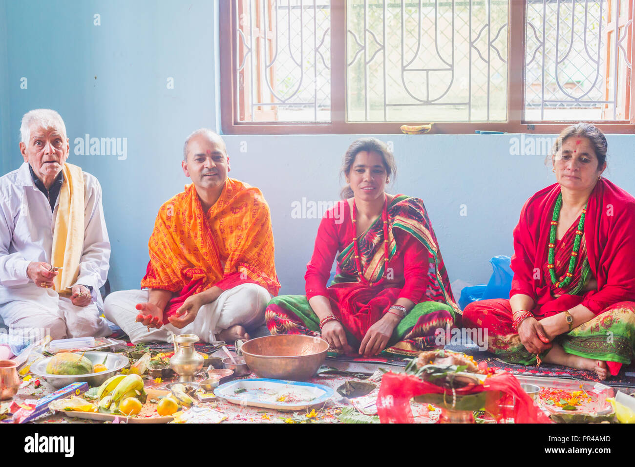 kathmandu,Nepal - Mar 10,2018: A Hindu Family Worshiping god at home ...