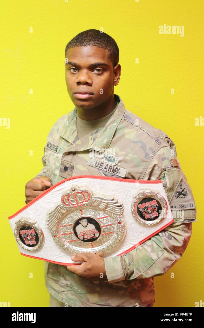 Spc. Michael Nickerson, an armor crewman and the brigade executive officer’s driver for 3rd Armored Brigade Combat Team 1st Armored Division, poses with a boxing belt that we earned at the 2nd Annual Henry Gutierrez Memorial Event. Stock Photo