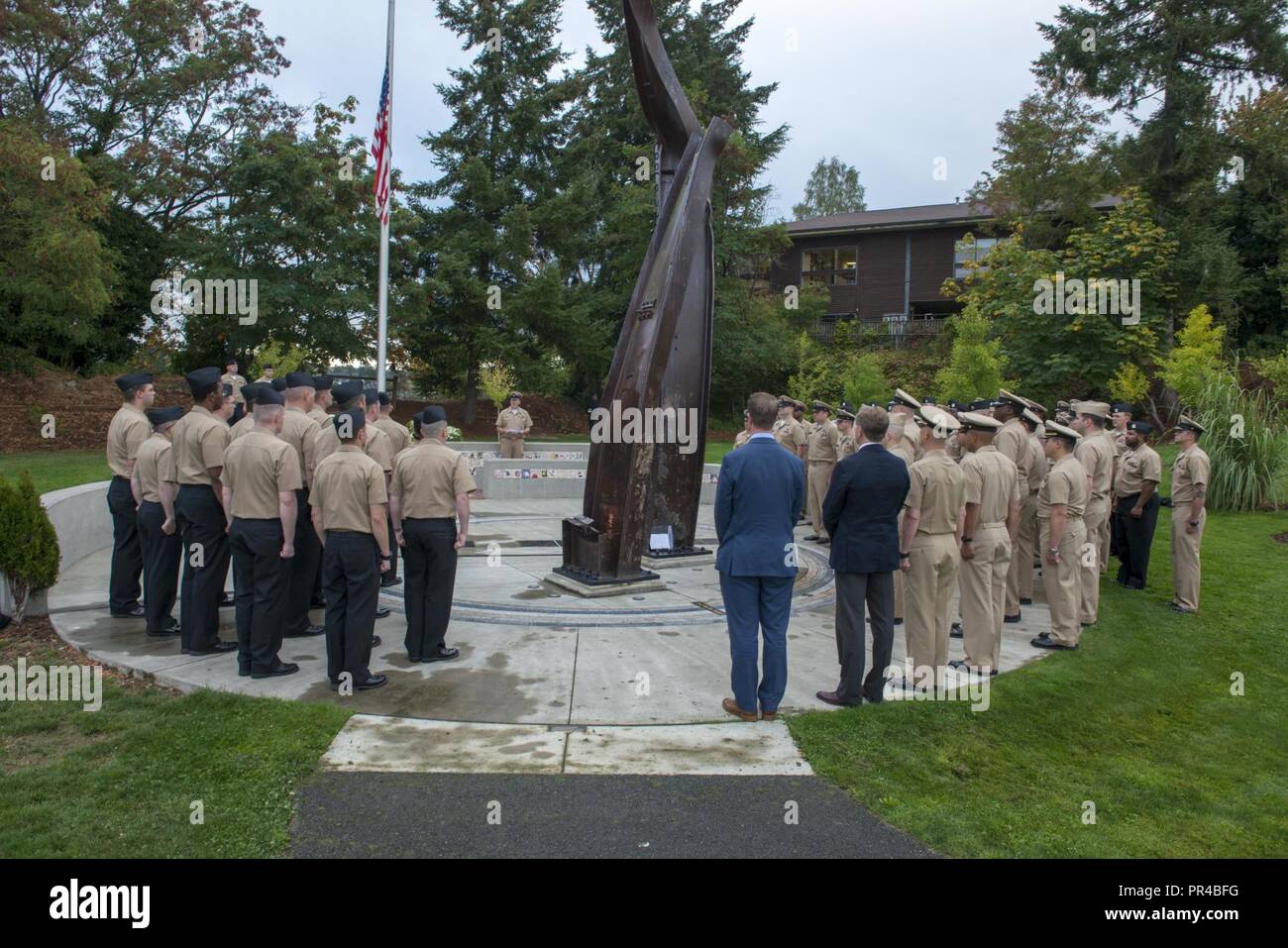 BREMERTON, Wash. (Sept. 11, 2018) Chief Electrician's Mate Anthony Vezina, assigned to Submarine Development Squadron (DEVRON) 5, delivers remarks during a 9/11 Remembrance Ceremony held at the Kitsap 9/11 Memorial. The ceremony, held by the 2019 DEVRON 5 Chief Petty Officer Selects, marks the 17th anniversary of the 9/11 attacks and honors those who lost their lives that day. Stock Photo