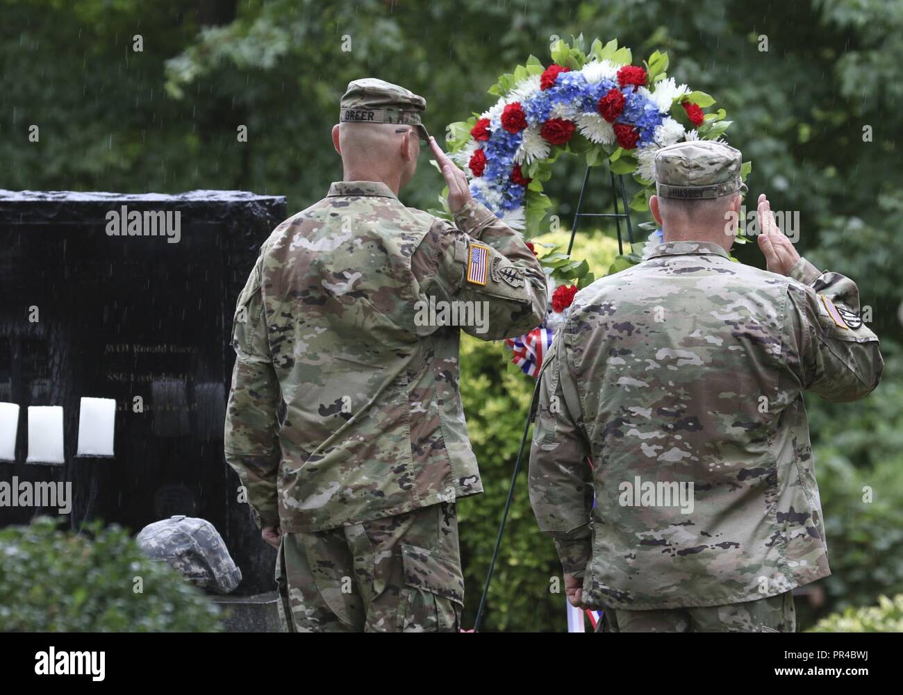 Col. Michael M. Greer (left), and Brig. Gen. John F. Hussey place a wreath on the memorial during the 9/11 Day of Remembrance ceremony at Fort Totten, New York on September 9, 2018. Wreath laying ceremonies are a tradition performed to honor fallen Soldiers. (Army Stock Photo