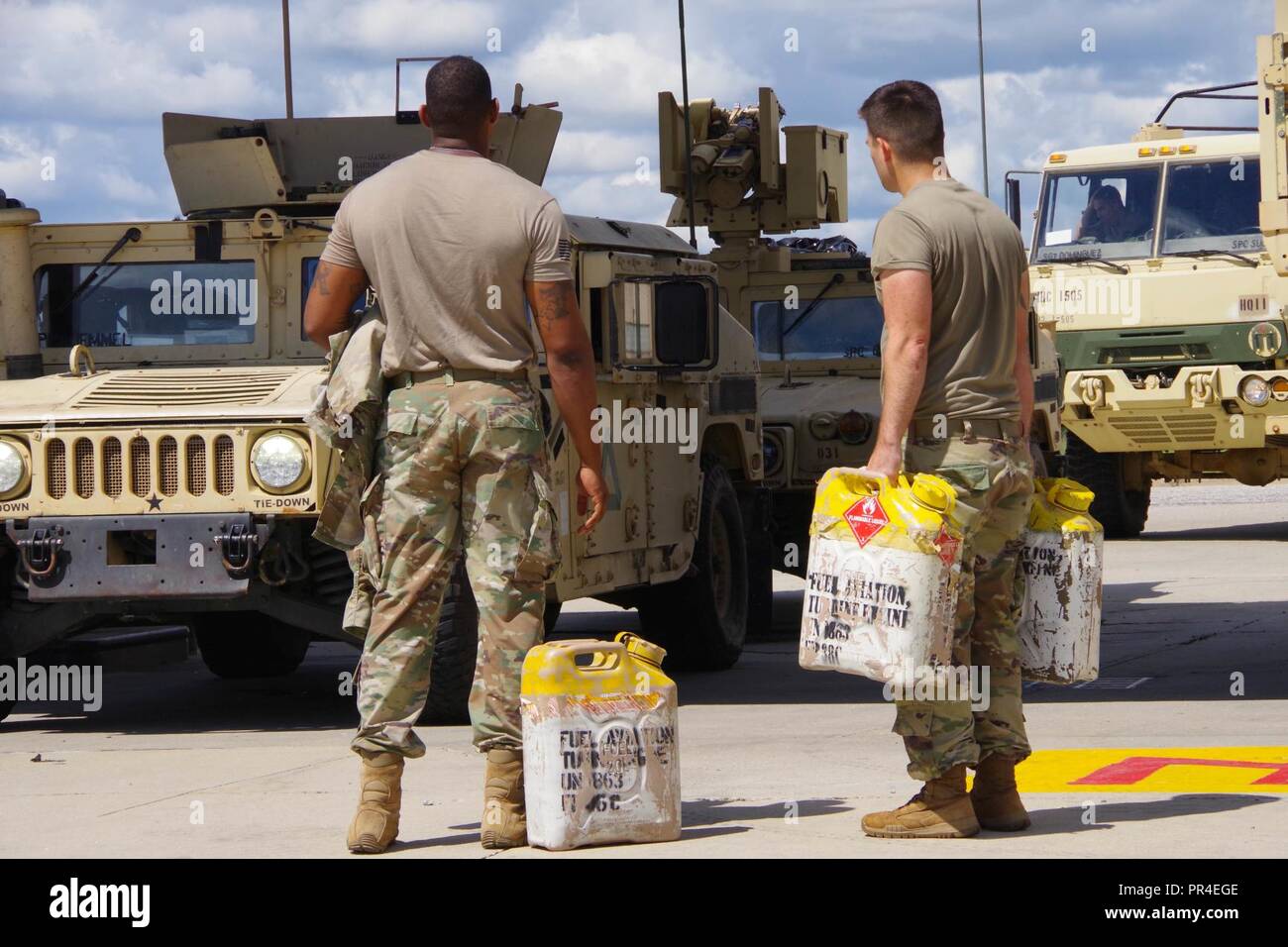 82nd Airborne Division Soldiers get fuel cans ready in preparation for
