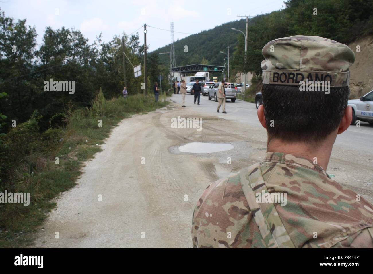 Bravo Troop 1st Sgt. Anthony Bordano from the 3-61 CAV observes the Administrative Boundary Line crossing point DOG31 between Kosovo and Serbia during the visit of Serbian Pres. Aleksandar Vucic on Sept. 8. Stock Photo