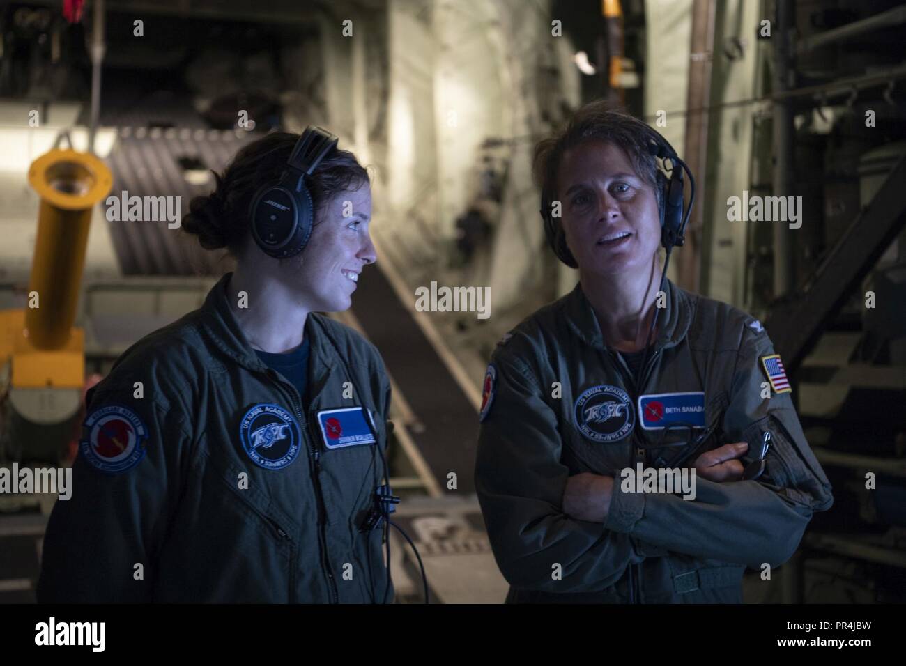 U.S. Navy Midshipman Shannon McAllister (left) and Captain Beth Sanabia are mission scientist's during a Hurricane Hunters mission that took off from the US Naval Academy   Savanah Air National Guard Base, Savanah, GA Airport, September 13, 2018. The U.S. Air Force Reserve 53rd Weather Reconnaissance Squadron, or Hurricane Hunters, is conducting a storm tasking mission into Hurricane Florence using a WC-130J Hercules, currently a category 2 storm. The flight tasking provides critical and timely weather data for the National Hurricane Center to assist in providing up-to-date and accurate inform Stock Photo