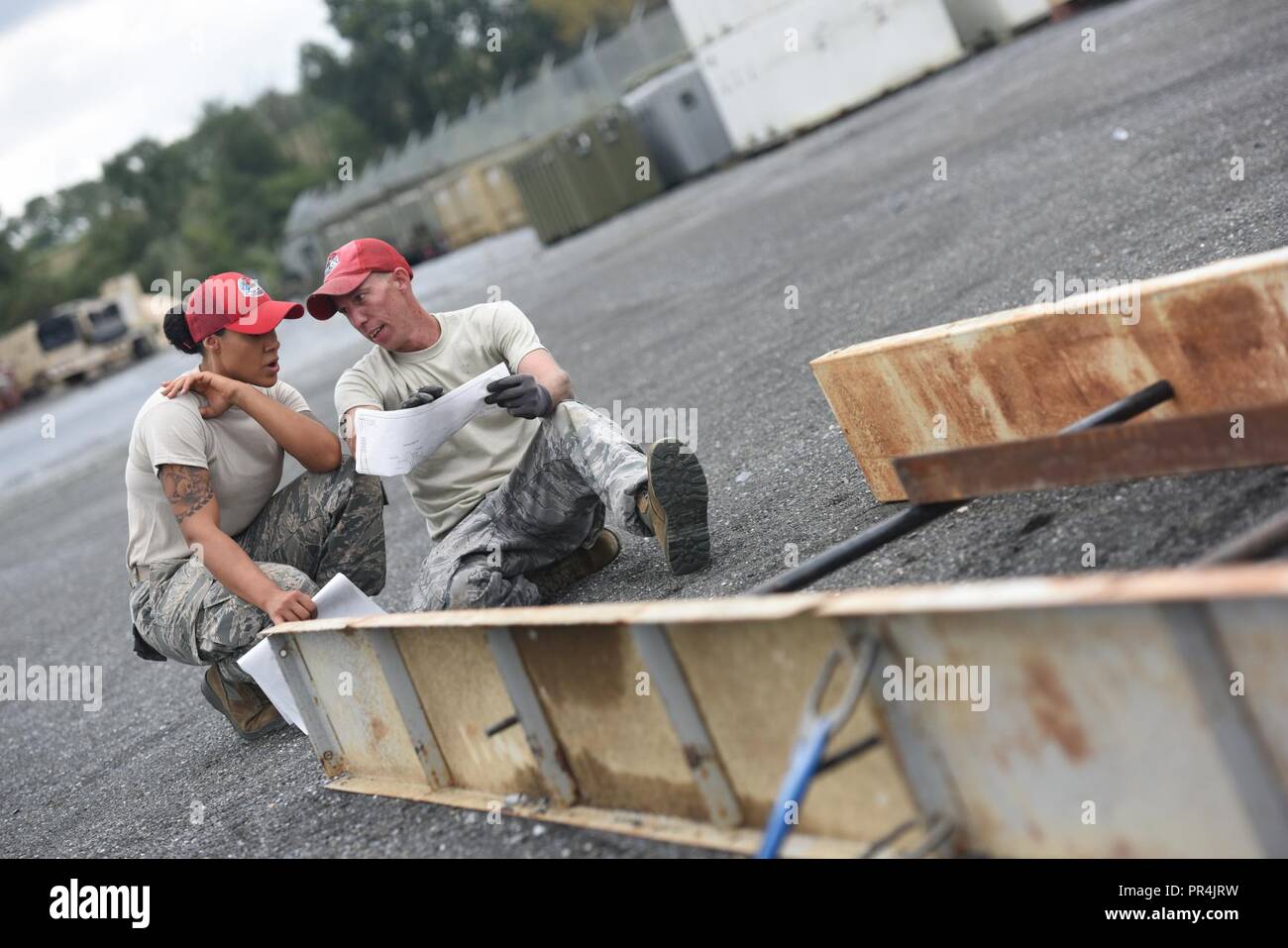 https://c8.alamy.com/comp/PR4JRW/airmen-with-the-201st-red-horse-squadron-fort-indiantown-gap-pennsylvania-discuss-the-layout-plans-of-a-building-during-the-field-training-exercise-sept-7-2018-ensuring-airmen-were-clear-about-how-the-building-was-laid-out-was-crucial-before-beginning-the-welding-process-PR4JRW.jpg