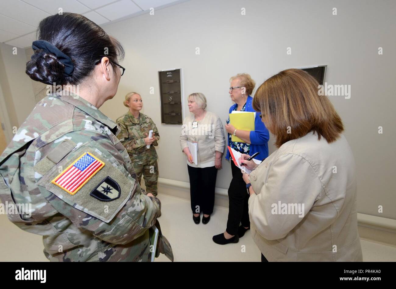From left: Col. Hengmo McCall, Deputy Chief of Nursing Weed Army Community Hospital, Maj. Samantha Hanson, Chief of Quality Services Weed Army Community Hospital conduct leadership walk through with staff members from the Joint Commission Center for Transforming Healthcare during a site visit at Weed Army Community Hospital Sept. 13. Stock Photo