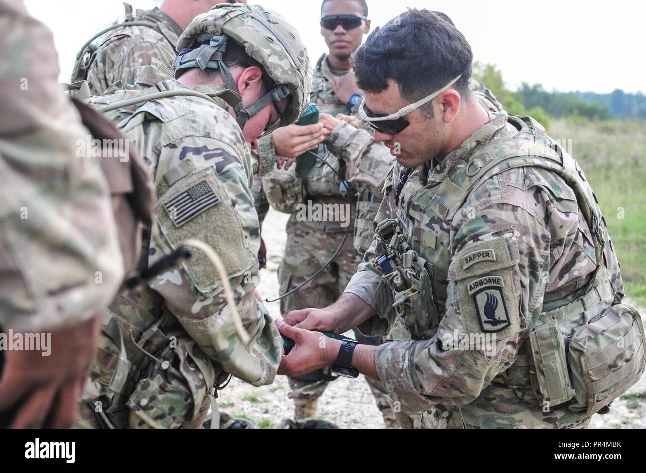 A Combat Engineer assigned to Castle Company, 54th Brigade Engineer  Battalion - Airborne, demonstrates how to prepare a mine displacement  charge in Grafenwoehr Training Area, Germany during Saber Junction 2018.  Exercise Saber, image size:1300x953