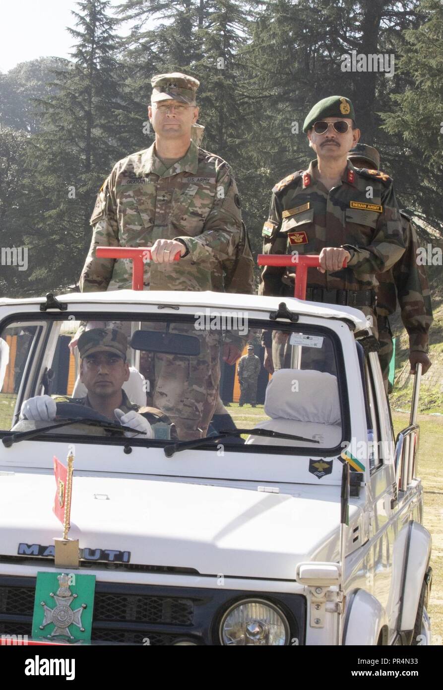 Maj. Gen. William Graham, the force commander for Yudh Abhyas 18, and Maj. Gen. Kabindra Singh, exercise director, perform a pass and review of the soldiers participating in Yudh Abhyas 18, Sept. 16, at Chaubattia Military Station in Ranikhet, India. The bilateral training exercise geared toward enhancing cooperation and coordination between the U.S. and Indian armies through professional development and cultural exchanges. Stock Photo
