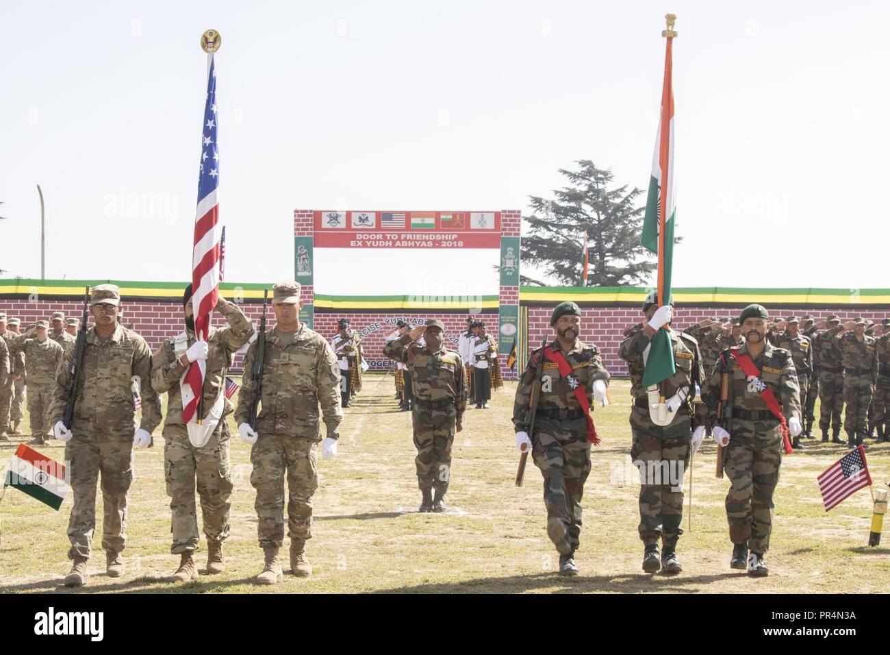 Color guards with the U.S. and Indian armies bear their respective nations’ colors during the Yudh Abhyas opening ceremony at Chaubattia Military Station in Ranikhet, India, Sept. 16, 2018. The bilateral exercise is geared toward enhancing cooperation and coordination between the two nations’ armies through training and cultural exchanges. Stock Photo