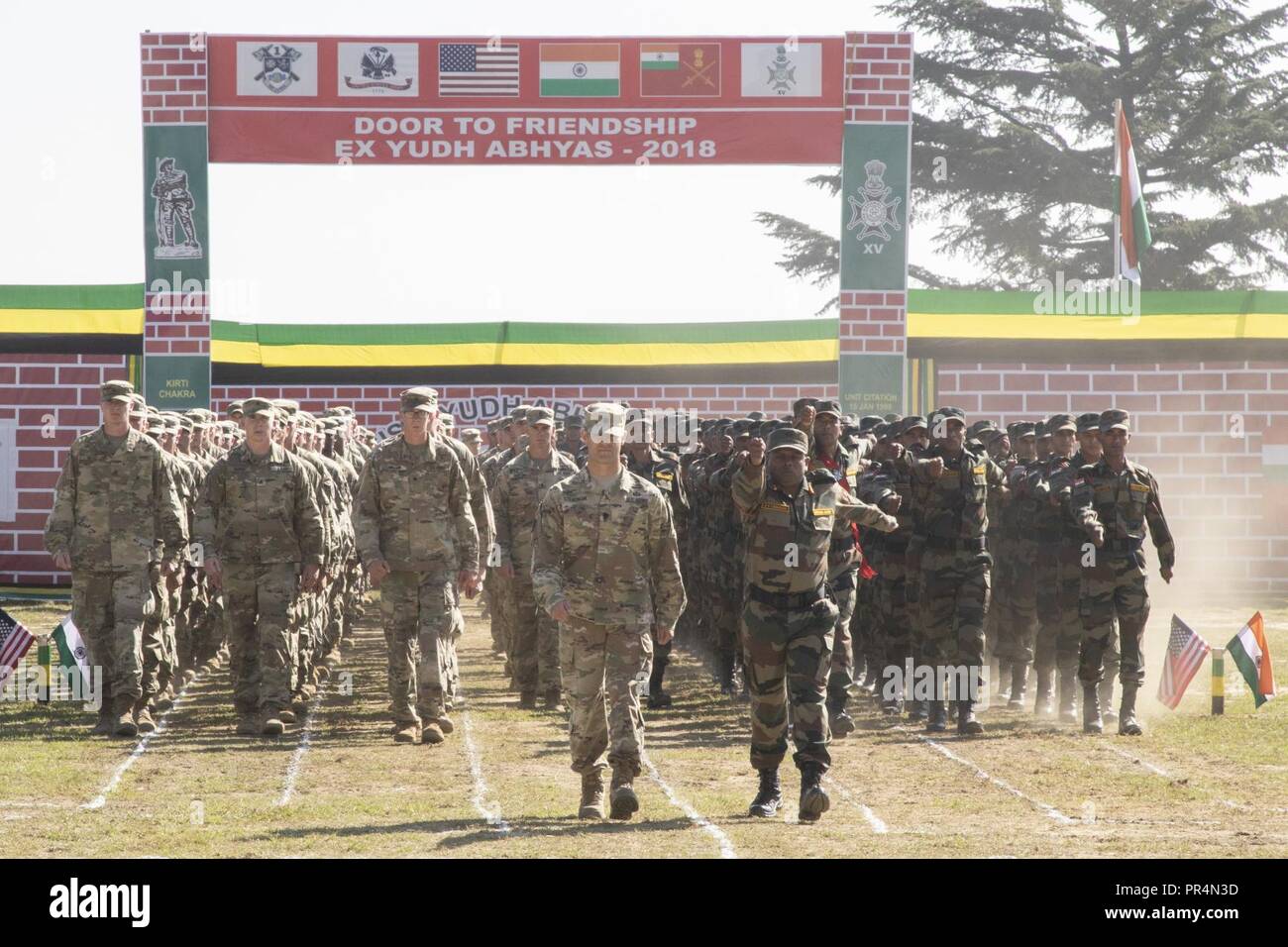 Soldiers with the U.S. and Indian Armies march onto a parade field at Chaubattia Military Station in Ranikhet, India, Sept. 16, 2018, during the opening ceremony of Yudh Abhyas 18. The bilateral training exercise geared toward enhancing cooperation and coordination between the two nations’ armies through training and cultural exchanges. Stock Photo