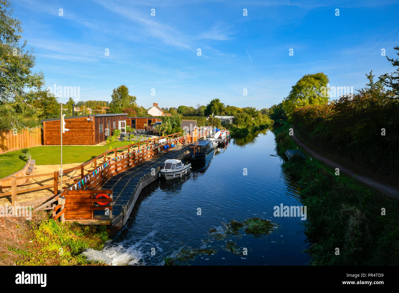 Uk Weather Barges Tied Up At A Landing On The Bridgwater And Taunton C Near Hedging In Somerset On A Day Of Sunshine And Clear Blue Uk Weather Barges Tied Up At A Landing On The Bridgwater And Taunton C Near Hedging In Somerset On A Day Of Sunshine And Clear Blue