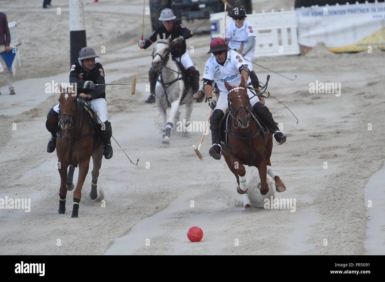 29 September 2018, Mecklenburg-Western Pomerania, Sellin: Beach Polo players Joaquin Copella and Berty Zalazar compete for the ball at the beach of the Baltic resort of Sellin in the 9th German Beach Polo Championship. Photo: Stefan Sauer/dpa-Zentralbild/dpa Stock Photo