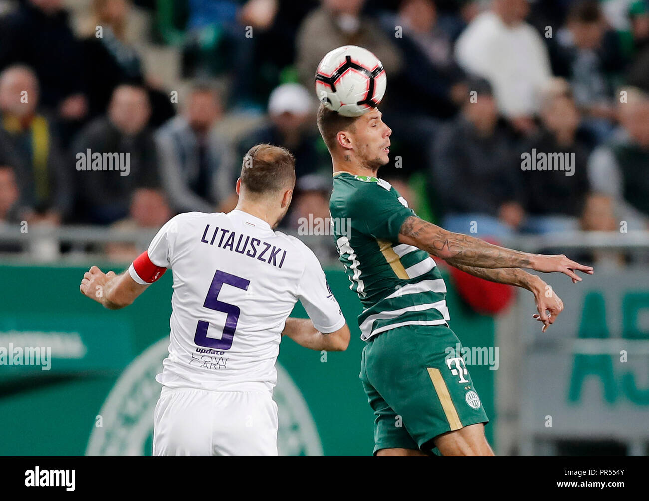 Budapest, Hungary. 31st August, 2023. Barnabas Varga of Ferencvarosi TC  competes for the ball with Nassim Hnid of FK Zalgiris Vilnius during the  UEFA Europa Conference League Play Off Round Second Leg