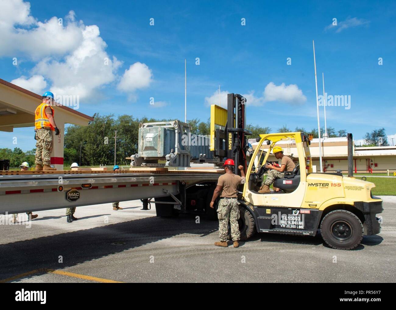 Sailors assigned to Navy Cargo Handling Battalion (NCHB) 1, Det. Guam ...