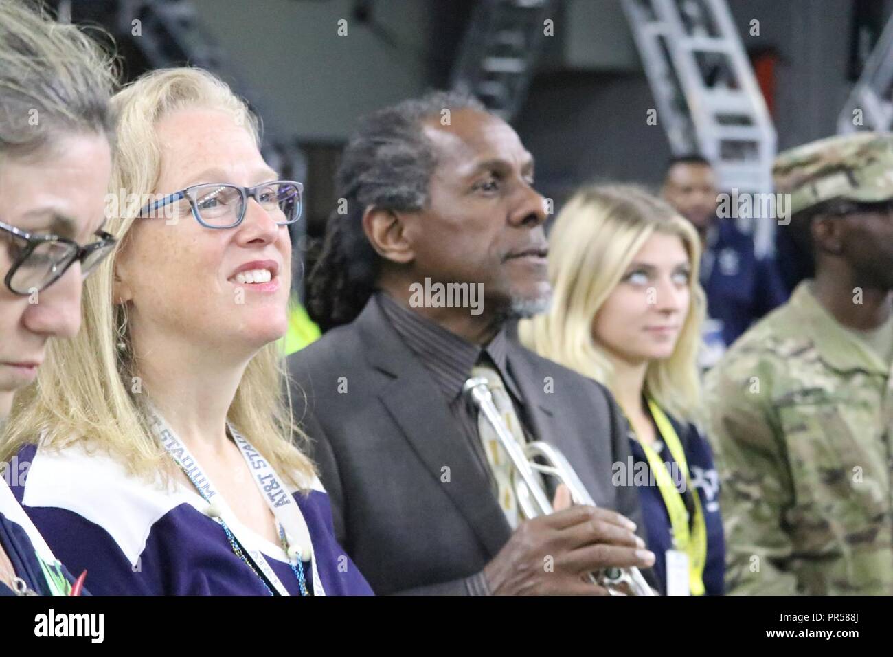 Jazz musician Freddie Jones looks out onto the field during pregame