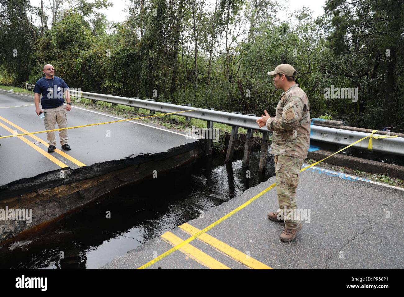 U.S. Border Patrol Search Trauma and Rescue (BORSTAR) team members help ...
